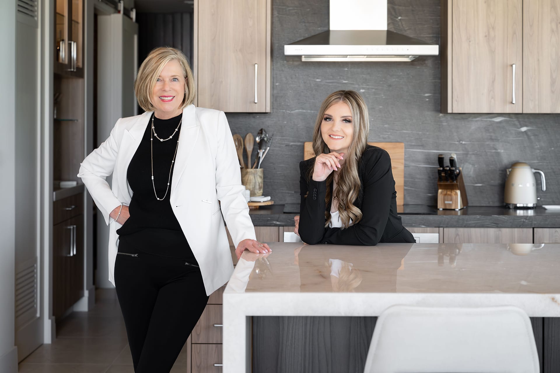 Diane Cabral leaning on a kitchen counter with Robyn